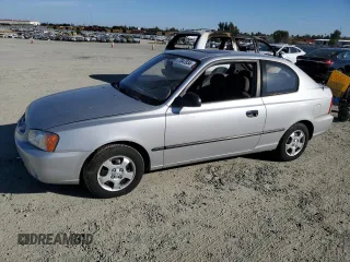 2002 Hyundai Accent z VIN KMHCF35G62U203274, wystawiony jako Copart lot #77047834 z przebiegiem 90 442 mil mil oraz Szkoda całkowita • Salvage title. Historia ofert i sprzedaży dostępna na DreamBid. Obrazek 1.