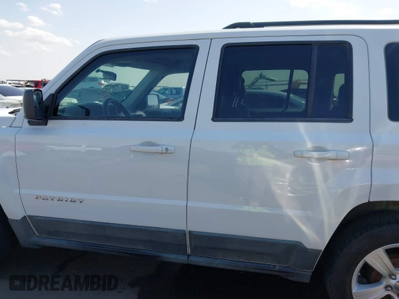 2011 Jeep Patriot Latitude with VIN 1J4NT1GB5BD245263, listed as a IAAI auction lot 41942376 with 215,147 mi miles. Bid and sale history available at carsss.com. Image 14.