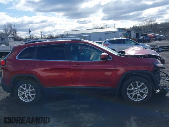 2014 Jeep Cherokee Latitude z VIN 1C4PJMCSXEW141453, wystawiony jako IAAI lot #41975311 z przebiegiem 150 085 mil mil oraz . Historia ofert i sprzedaży dostępna na DreamBid. Obrazek 13.