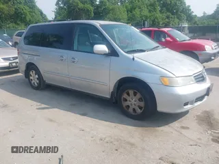 2004 Honda Odyssey EX-L z VIN 5FNRL18074B059918, wystawiony jako IAAI lot #42501794 z przebiegiem 236 215 mil mil oraz . Historia ofert i sprzedaży dostępna na DreamBid. Obrazek 1.