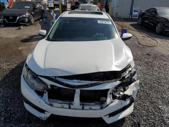 2018 Honda Civic EX с VIN 19XFC2F7XJE034358, выставлен на аукционе Copart как лот 43976415 с пробегом 117 514 миль миль и Списание • Salvage title. История ставок и продаж доступна на DreamBid. Изображение 5.
