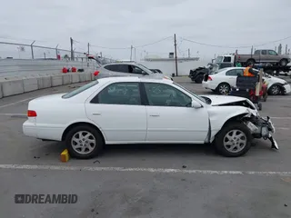 2000 Toyota Camry LE z VIN JT2BF28K3Y0289145, wystawiony jako IAAI lot #42455085 z przebiegiem 202 809 mil mil oraz . Historia ofert i sprzedaży dostępna na DreamBid. Obrazek 13.