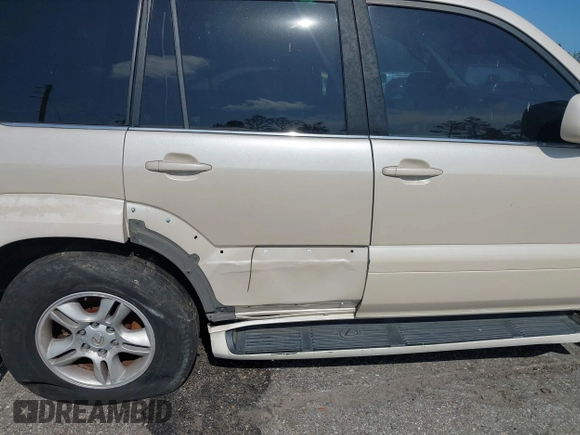 2003 Lexus GX 470 with VIN JTJBT20X630019033, listed as a IAAI auction lot 42128698 with 286,811 mi miles and . Bid and sale history available at DreamBid. Image 6.