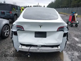 2025 Tesla Model Y Long Range with VIN 7SAYGDEDXSF248734, listed as a IAAI auction lot 41719195 with 5,876 mi miles and . Bid and sale history available at DreamBid. Image 16.