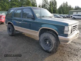 1992 Ford Explorer Eddie Bauer with VIN 1FMDU34X1NUB84827, listed as a Copart auction lot 86973574 with 73,452 mi miles and Salvage title. Bid and sale history available at DreamBid. Image 4.