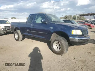 2003 Ford F-150 XL with VIN 1FTRX17L13NA95202, listed as a Copart auction lot 87766385 with 124,961 mi miles and Salvage Title. Bid and sale history available at carsss.com. Image 4.