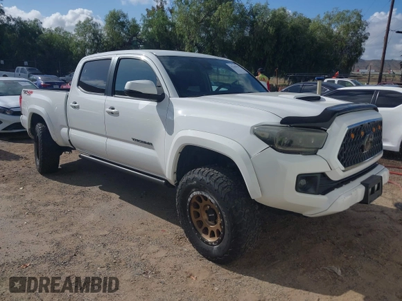 2018 Toyota Tacoma SR5 with VIN 3TMDZ5BN2JM037580, listed as a IAAI auction lot 42248418 with 35,661 mi miles and . Bid and sale history available at DreamBid. Image 1.