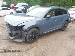 2022 Mazda CX-9 Grand Touring with VIN JM3TCBDY0N0615968, listed as a IAAI auction lot 42312159 with 22,912 mi miles and . Bid and sale history available at DreamBid. Image 2.