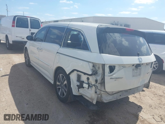 2016 Honda Odyssey Touring Elite with VIN 5FNRL5H98GB102544, listed as a IAAI auction lot 42040050 with 128,957 mi miles and . Bid and sale history available at DreamBid. Image 3.