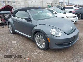 2013 Volkswagen Beetle 2.5L with VIN 3VW5X7ATXDM813283, listed as a IAAI auction lot 42489711 with 69,821 mi miles and . Bid and sale history available at DreamBid. Image 1.