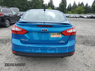 2013 Ford Focus SE with VIN 1FADP3F25DL295338, listed as a Copart auction lot 60225485 with 82,979 mi miles and Salvage title. Bid and sale history available at DreamBid. Image 6.