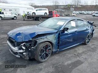 2022 BMW 5 Series M550i xDrive with VIN WBA13BK08NCJ54124, listed as a IAAI auction lot 41977413 with Not provided miles and . Bid and sale history available at DreamBid. Image 2.
