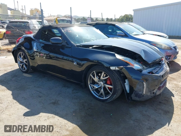 2014 Nissan 370Z Touring with VIN JN1AZ4FH8EM620208, listed as a IAAI auction lot 42094292 with 68,799 mi miles and . Bid and sale history available at DreamBid. Image 1.