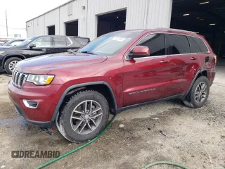 2018 Jeep Grand Cherokee Laredo E with VIN 1C4RJEAG9JC513373, listed as a Copart auction lot 60822695 with 105,717 mi miles and Salvage title. Bid and sale history available at DreamBid. Image 1.