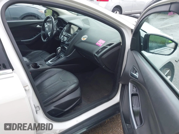2014 Ford Focus Titanium with VIN 1FADP3N24EL184220, listed as a IAAI auction lot 42429610 with 172,575 mi miles and . Bid and sale history available at DreamBid. Image 5.