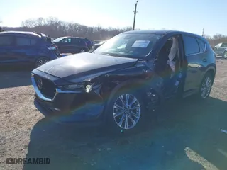 2021 Mazda CX-5 Grand Touring with VIN JM3KFBDM4M0471467, listed as a IAAI auction lot 41825406 with 43,529 mi miles. Bid and sale history available at carsss.com. Image 2.