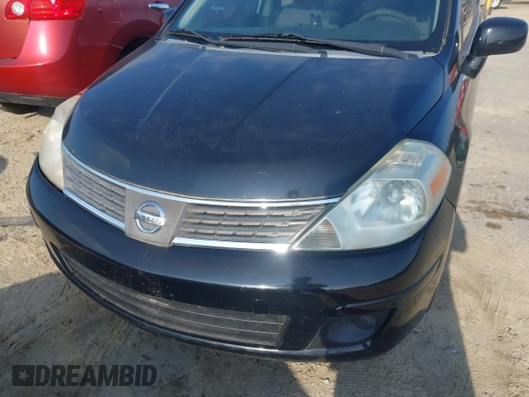 2007 Nissan Versa 1.8 S with VIN 3N1BC13E97L359537, listed as a IAAI auction lot 42127935 with 128,891 mi miles. Bid and sale history available at carsss.com. Image 6.
