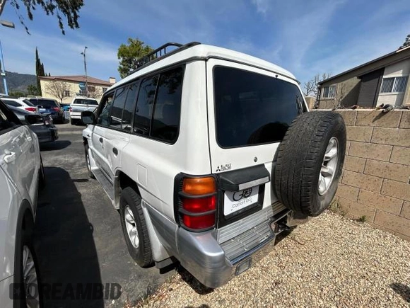 2000 Mitsubishi Montero z VIN JA4MR51R6YJ002305, wystawiony jako Copart lot #50263015 z przebiegiem 138 861 mil mil oraz Czysty tytuł • Clean title. Historia ofert i sprzedaży dostępna na DreamBid. Obrazek 3.