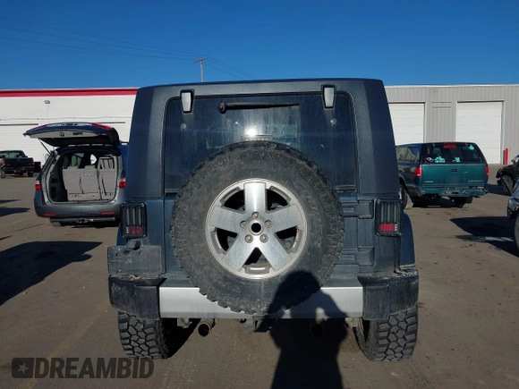 2008 Jeep Wrangler Sahara with VIN 1J4FA54108L543764, listed as a IAAI auction lot 41867734 with 186,145 mi miles and . Bid and sale history available at DreamBid. Image 17.