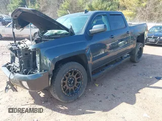 2017 Chevrolet Silverado 1500 LT with VIN 3GCUKREC6HG451671, listed as a IAAI auction lot 41906060 with Not Provided miles and . Bid and sale history available at DreamBid. Image 2.