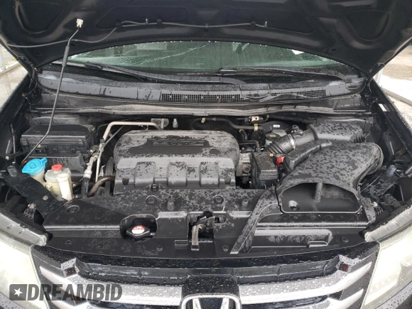 2015 Honda Odyssey Touring Elite с VIN 5FNRL5H91FB107793, выставлен на аукционе Copart как лот 59295355 с пробегом 91 910 миль миль и Списание • Salvage title. История ставок и продаж доступна на DreamBid. Изображение 12.