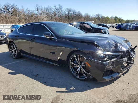 2020 BMW 8 Series M850i with VIN WBAGV8C02LCE34594, listed as a Copart auction lot 50389675 with 37,279 mi miles and Salvage title. Bid and sale history available at DreamBid. Image 4.