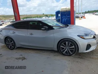 2020 Nissan Maxima SV z VIN 1N4AA6CV6LC366887, wystawiony jako IAAI lot #41952159 z przebiegiem 100 182 mil mil oraz . Historia ofert i sprzedaży dostępna na DreamBid. Obrazek 13.
