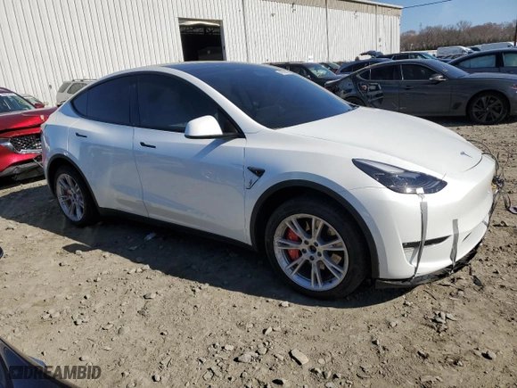 2023 Tesla Model Y Long Range with VIN 7SAYGAEE4PF594793, listed as a Copart auction lot 49733815 with 33,868 mi miles and Salvage Title. Bid and sale history available at carsss.com. Image 4.