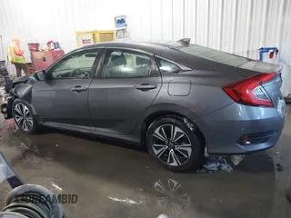2018 Honda Civic EX-T with VIN JHMFC1F35JX031132, listed as a IAAI auction lot 41591028 with 111,087 mi miles and . Bid and sale history available at DreamBid. Image 14.