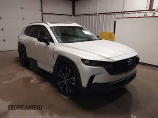 2023 Mazda CX-50 S Premium Plus with VIN 7MMVABEMXPN139186, listed as a IAAI auction lot 41289690 with 26,556 mi miles and . Bid and sale history available at DreamBid. Image 1.