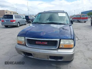 1999 GMC Jimmy SLE with VIN 1GKDT13W8X2526345, listed as a IAAI auction lot 41919975 with 164,214 mi miles. Bid and sale history available at carsss.com. Image 6.