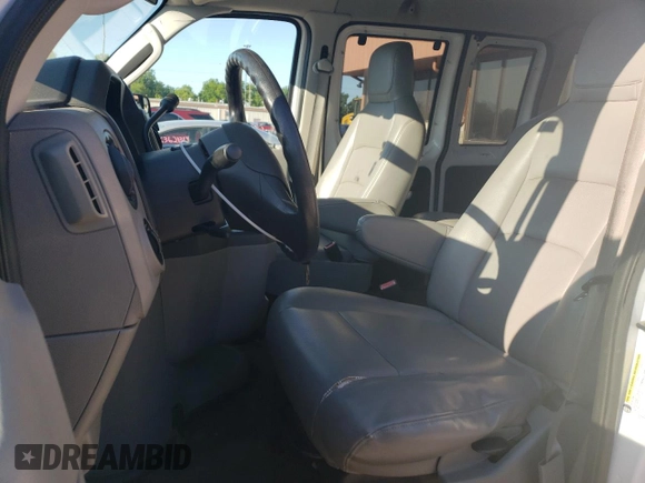 2010 Ford Econoline Passenger XL with VIN 1FMNE1BW2ADA11991, listed as a Copart auction lot 63758014 with 32,785 mi miles and Salvage Title. Bid and sale history available at DreamBid. Image 7.