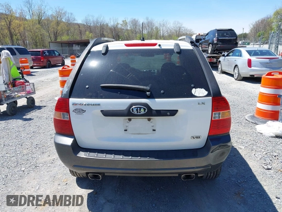 2006 Kia Sportage LX with VIN KNDJF723567151614, listed as a IAAI auction lot 42022102 with 128,564 mi miles and . Bid and sale history available at carsss.com. Image 16.