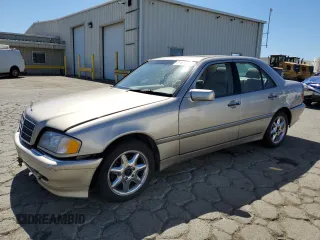 1998 Mercedes-Benz C 230/260/280/320 with VIN WDBHA23G4WA564563, listed as a Copart auction lot 71414284 with 277,741 mi miles and Salvage Title. Bid and sale history available at carsss.com. Image 1.