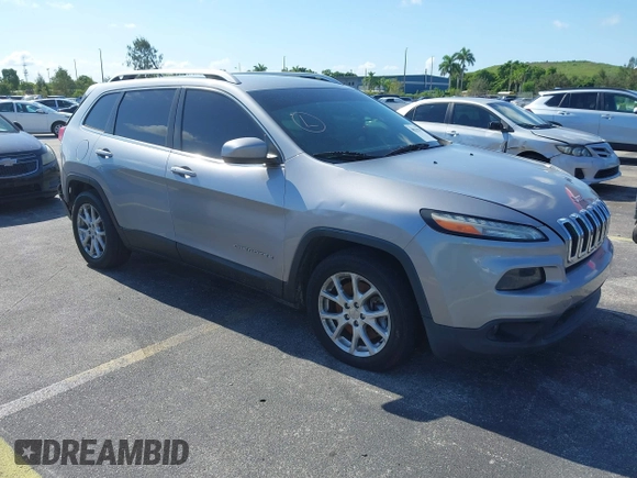 2014 Jeep Cherokee Latitude with VIN 1C4PJLCS6EW103423, listed as a IAAI auction lot 40118289 with 112,120 mi miles and . Bid and sale history available at DreamBid. Image 1.