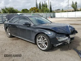 2015 Audi A8 4.0T with VIN WAUJ2AFD5FN013267, listed as a Copart auction lot 39065654 with 64,541 mi miles and . Bid and sale history available at DreamBid. Image 4.