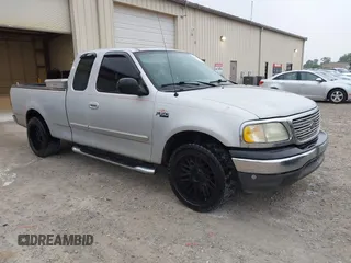 2003 Ford F-150 XL with VIN 1FTRX17253NA74389, listed as a IAAI auction lot 42072045 with 166,572 mi miles. Bid and sale history available at carsss.com. Image 1.
