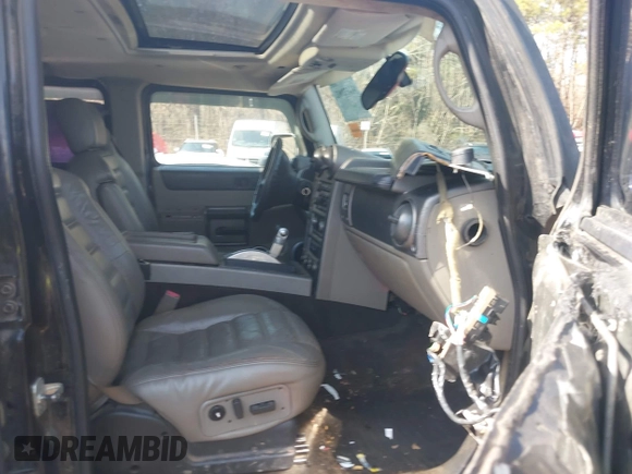 2003 Hummer H2 with VIN 5GRGN23U33H144379, listed as a IAAI auction lot 41452982 with 227,746 mi miles. Bid and sale history available at carsss.com. Image 5.