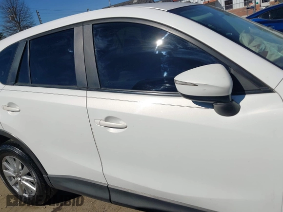 2016 Mazda CX-5 Sport with VIN JM3KE2BY9G0890587, listed as a IAAI auction lot 41685344 with 91,190 mi miles. Bid and sale history available at carsss.com. Image 13.