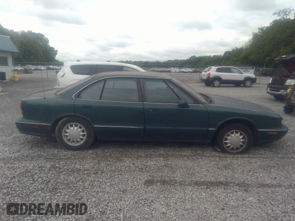 1998 Oldsmobile 88 LS z VIN 1G3HN52K5W4849011, wystawiony jako IAAI lot #42153650 z przebiegiem 171 969 mil mil oraz . Historia ofert i sprzedaży dostępna na DreamBid. Obrazek 13.