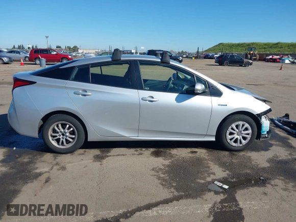 2021 Toyota Prius L Eco with VIN JTDKAMFU5M3130478, listed as a IAAI auction lot 41867606 with 52,223 mi miles. Bid and sale history available at carsss.com. Image 14.