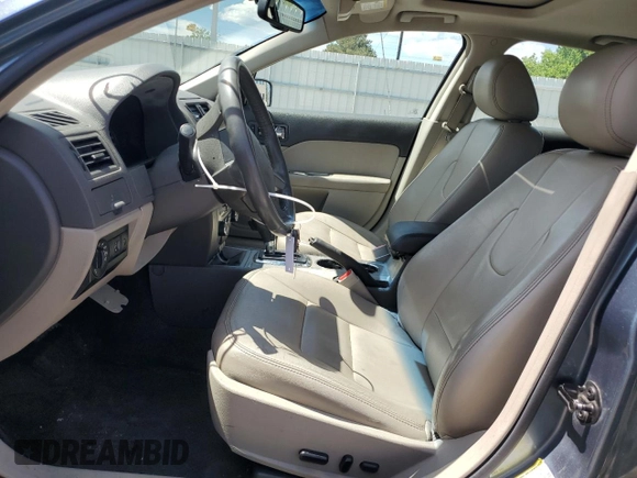 2012 Ford Fusion Hybrid z VIN 3FADP0L3XCR176552, wystawiony jako Copart lot #55787415 z przebiegiem 156 806 mil mil oraz Szkoda całkowita • Salvage title. Historia ofert i sprzedaży dostępna na DreamBid. Obrazek 7.