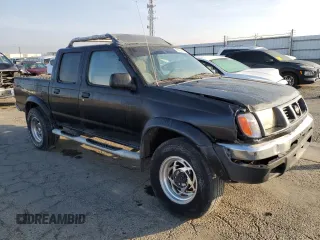 2000 Nissan Frontier XE z VIN 1N6ED27Y2YC369211, wystawiony jako Copart lot #80594884 z przebiegiem 225 194 mil mil oraz Czysty tytuł • Clean title. Historia ofert i sprzedaży dostępna na DreamBid. Obrazek 4.