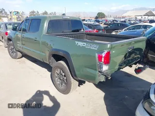 2021 Toyota Tacoma 4WD SR5 with VIN 3TMDZ5BN2MM101265, listed as a IAAI auction lot 41272874 with 51,989 mi miles. Bid and sale history available at carsss.com. Image 3.