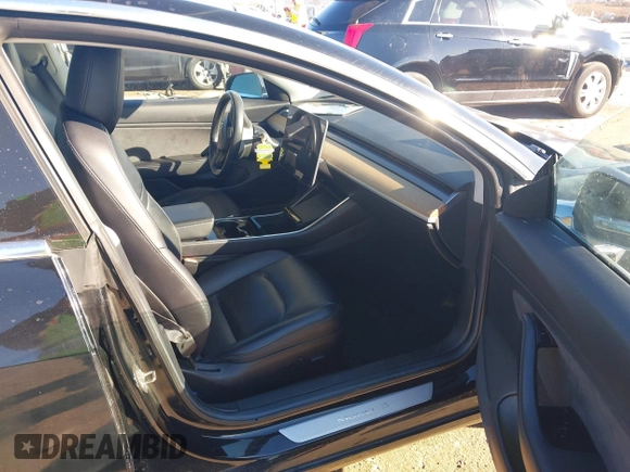 2018 Tesla Model 3 Long Range Battery with VIN 5YJ3E1EA2JF014975, listed as a IAAI auction lot 41319407 with 106,301 mi miles and . Bid and sale history available at DreamBid. Image 5.