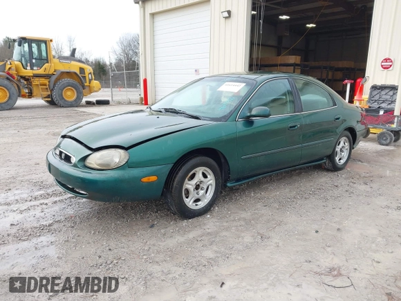 1999 Mercury Sable GS with VIN 1MEFM50U5XG633589, listed as a IAAI auction lot 41614442 with 241,833 mi miles. Bid and sale history available at carsss.com. Image 2.