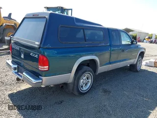 1999 Dodge Dakota SLT with VIN 1B7GG22Y2XS157214, listed as a IAAI auction lot 39776504 with 144,928 mi miles and . Bid and sale history available at carsss.com. Image 4.