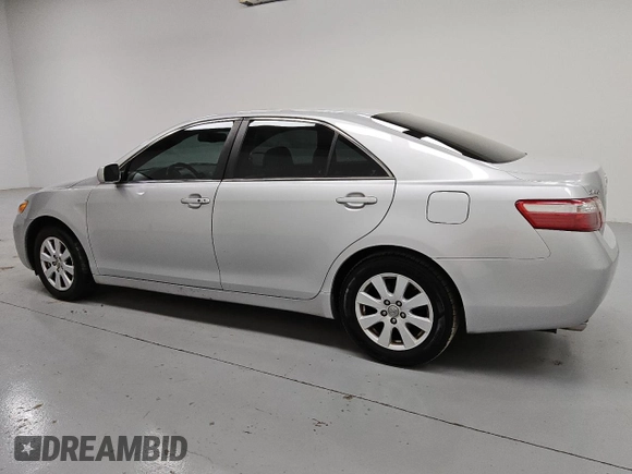 2009 Toyota Camry LE z VIN 4T1BK46K89U595880, wystawiony jako Copart lot #55069935 z przebiegiem 265 831 mil mil oraz Czysty tytuł • Clean title. Historia ofert i sprzedaży dostępna na DreamBid. Obrazek 2.