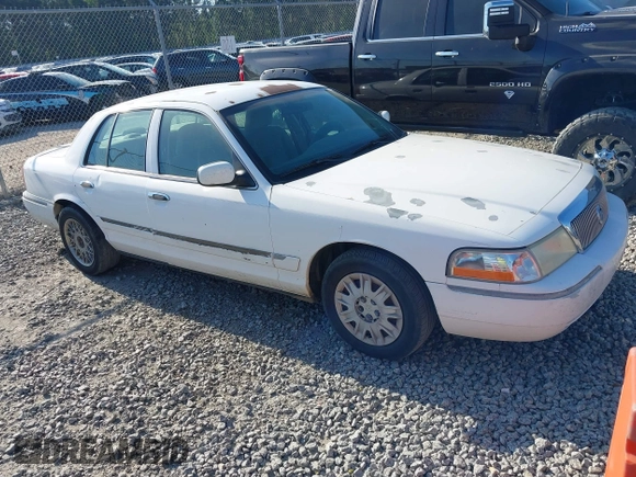 2004 Mercury Grand Marquis GS z VIN 2MEFM74W74X654151, wystawiony jako IAAI lot #42185493 z przebiegiem 203 017 mil mil oraz . Historia ofert i sprzedaży dostępna na DreamBid. Obrazek 1.