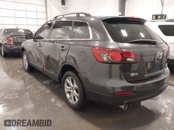 2015 Mazda CX-9 Sport with VIN JM3TB2BA1F0453620, listed as a IAAI auction lot 41330887 with 119,219 mi miles and . Bid and sale history available at carsss.com. Image 3.